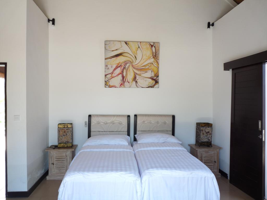 Taman Dewi Sri Villa Et Bungalow Pemuteran Oda fotoğraf